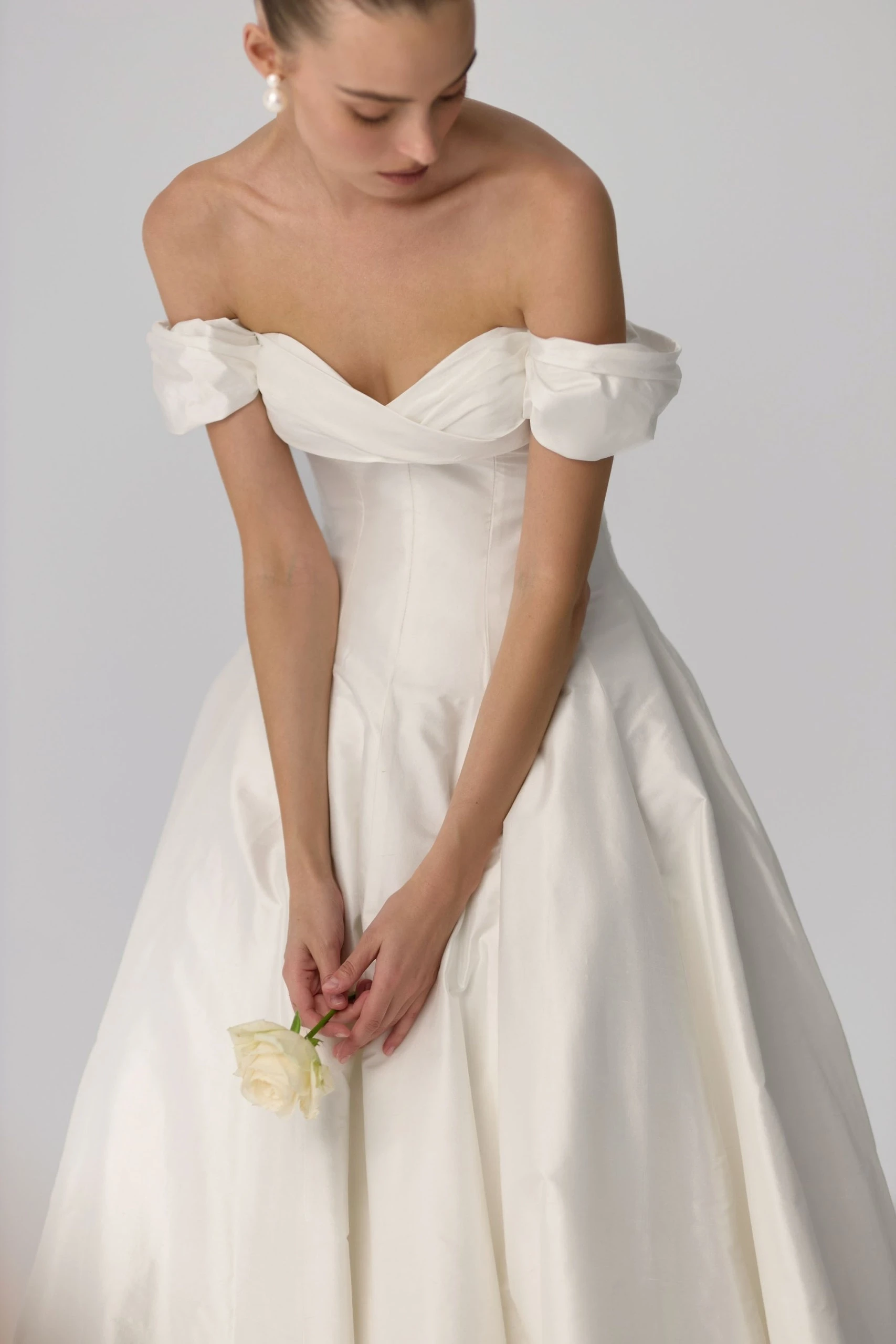 Сouple wearing a white gown and a black suit